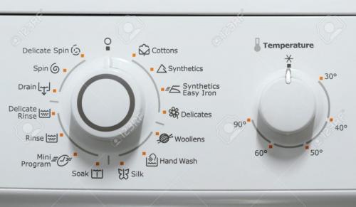 Mechanical timer and temperature selection controls on a top load washer